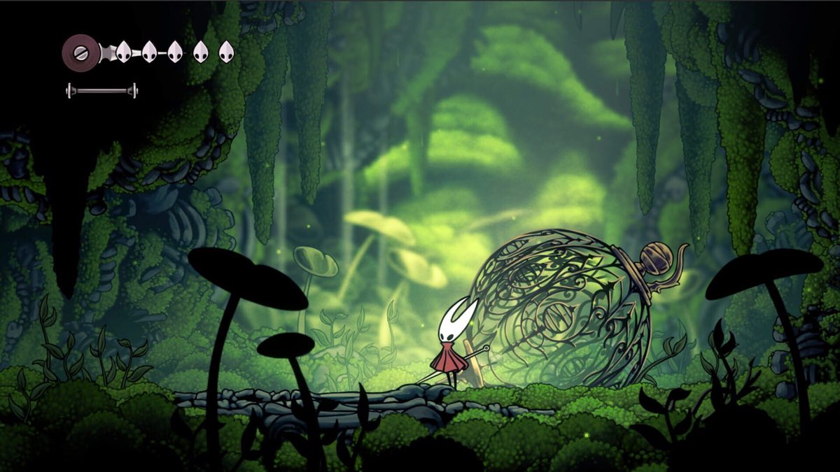 Exploring a lush green forest area in Hollow Knight: Silksong